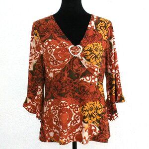 Rebound, yellow/brown floral blouse, with a metal heart design